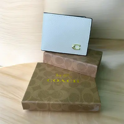 Billetera coach azul cielo 